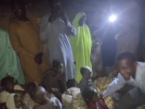 Night scene: Donating food items to Ajere II IDP in Maiduguri.